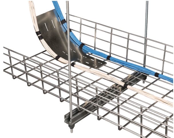 Metal cable tray with blue and white cables secured by black ties, featuring a metal bend for directing cables around a corner.